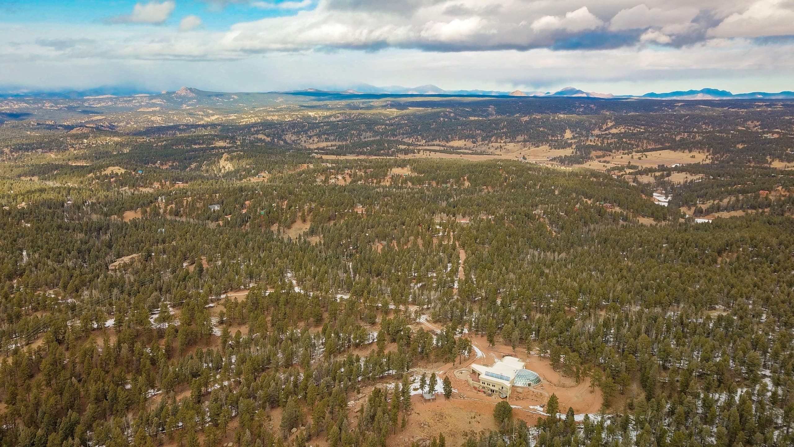 Aerial view of Kutsu Point ringed by forest on its forty private acres